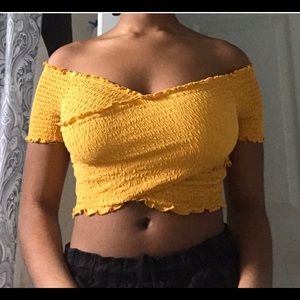 Selling a yellow crop top.